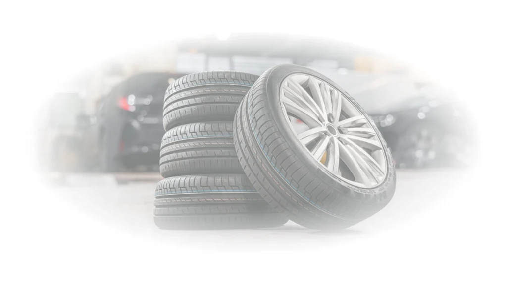 Tire Sales In Sterling, VA At Honest Tom Care. A stack of new car tires and one wheel leaning against the pile.